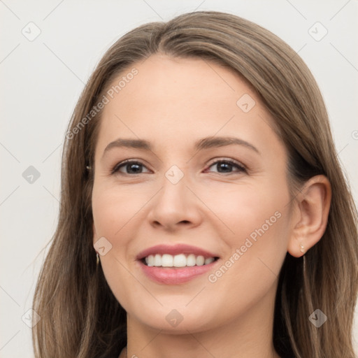 Joyful white young-adult female with long  brown hair and brown eyes