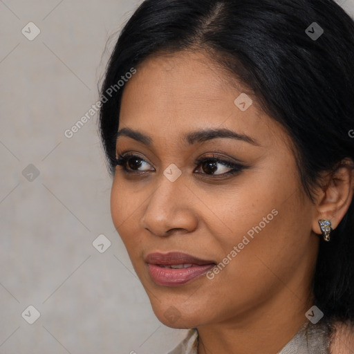 Joyful latino young-adult female with long  black hair and brown eyes