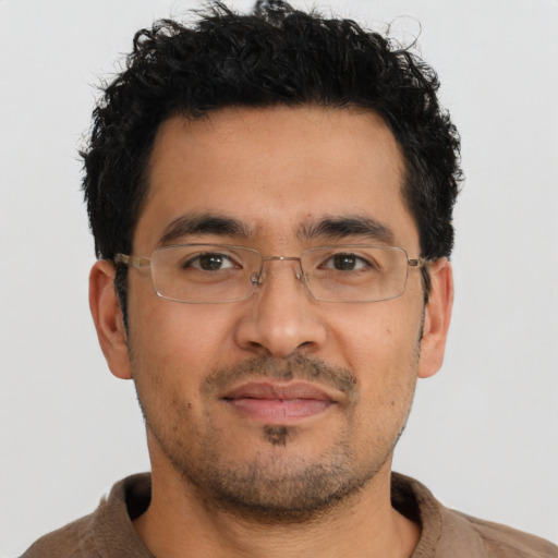 Neutral latino adult male with short  black hair and brown eyes