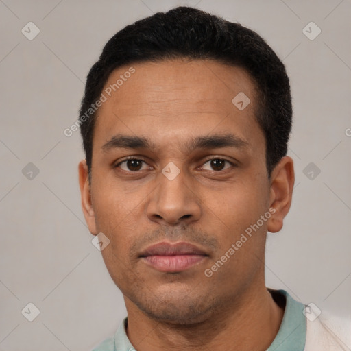 Neutral latino young-adult male with short  black hair and brown eyes