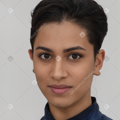 Joyful latino young-adult female with short  brown hair and brown eyes