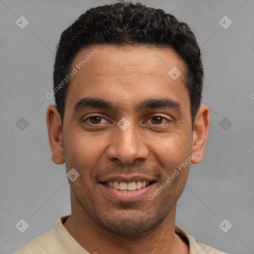 Joyful latino young-adult male with short  black hair and brown eyes