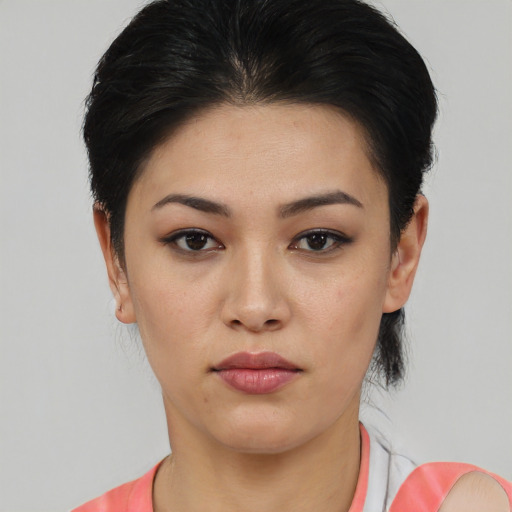 Joyful asian young-adult female with short  black hair and brown eyes