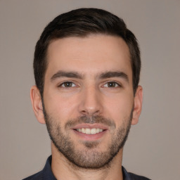 Joyful white young-adult male with short  brown hair and brown eyes