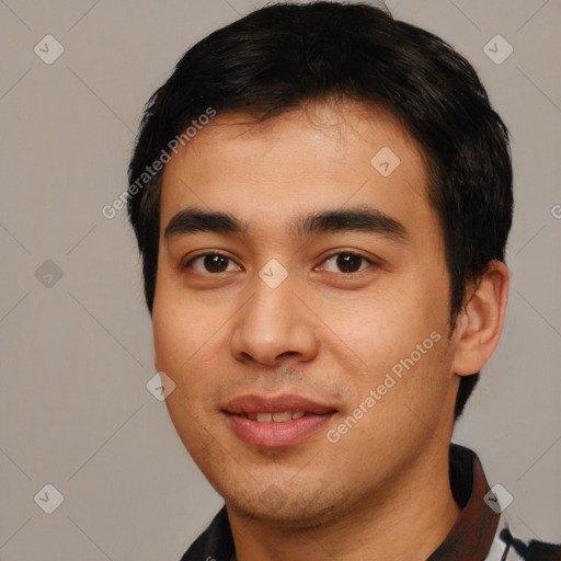 Joyful latino young-adult male with short  black hair and brown eyes