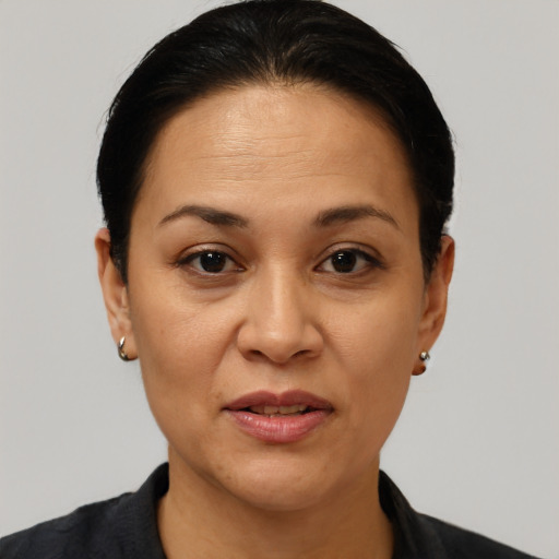 Joyful white adult female with short  brown hair and brown eyes
