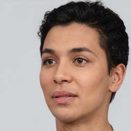 Joyful white young-adult male with short  black hair and brown eyes