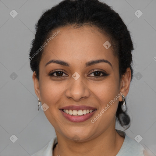 Joyful latino young-adult female with short  brown hair and brown eyes