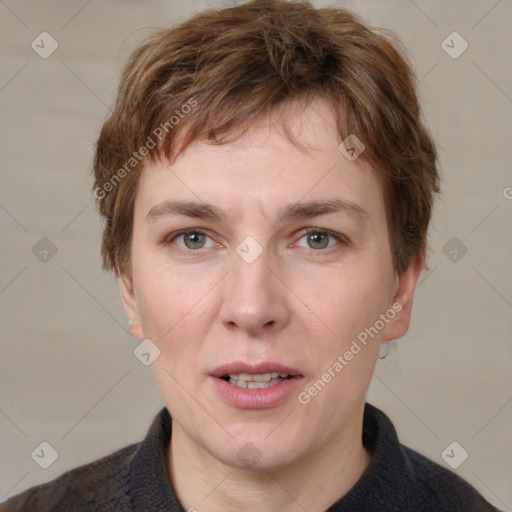 Joyful white adult male with short  brown hair and grey eyes