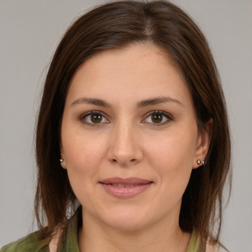 Joyful white young-adult female with medium  brown hair and brown eyes