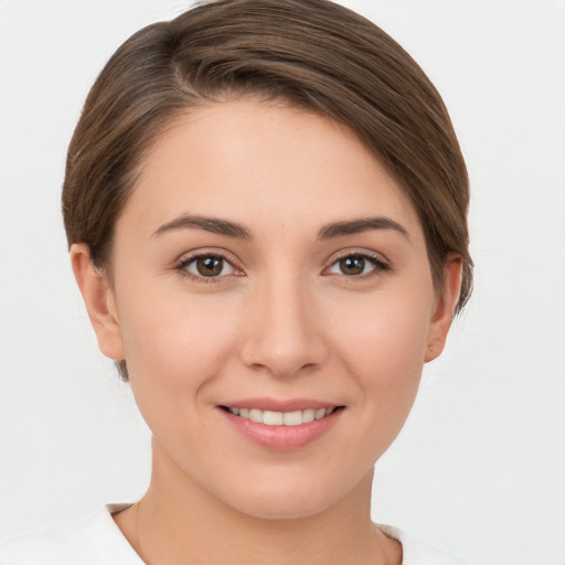 Joyful white young-adult female with short  brown hair and brown eyes