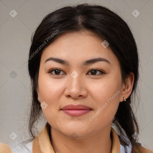 Joyful latino young-adult female with medium  brown hair and brown eyes