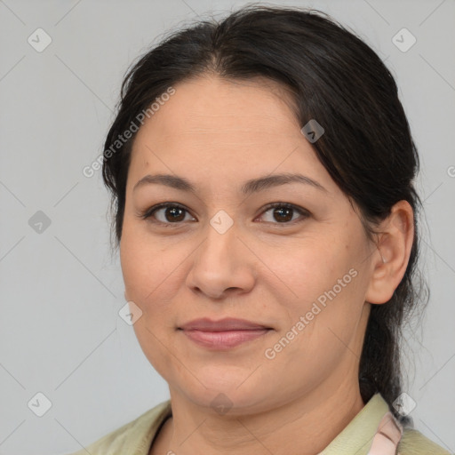 Joyful asian adult female with medium  brown hair and brown eyes