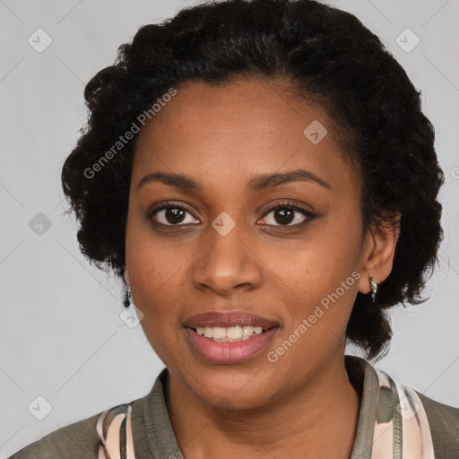 Joyful black young-adult female with long  black hair and brown eyes