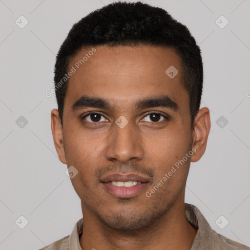 Joyful black young-adult male with short  black hair and brown eyes