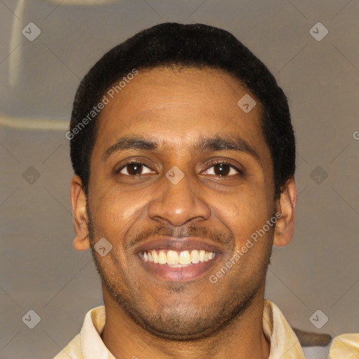 Joyful latino young-adult male with short  black hair and brown eyes