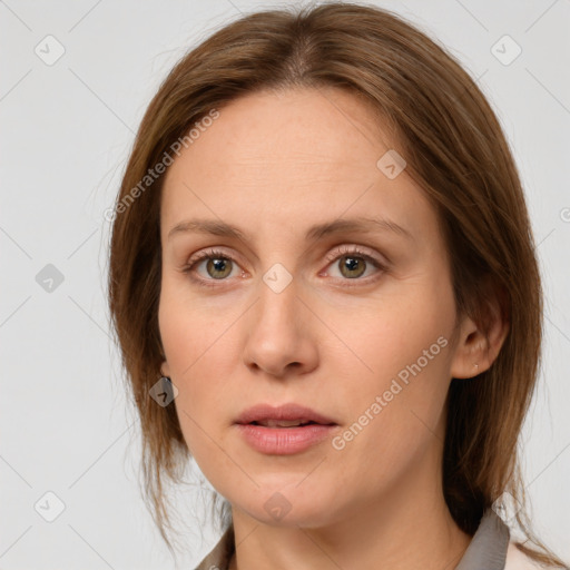 Neutral white young-adult female with medium  brown hair and grey eyes