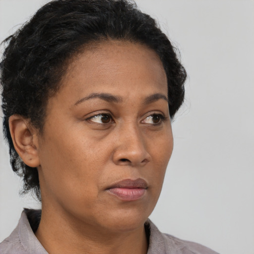 Neutral black adult female with short  brown hair and brown eyes