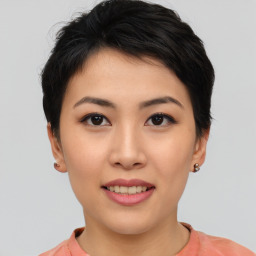 Joyful asian young-adult female with short  black hair and brown eyes