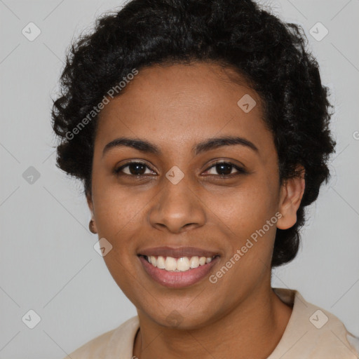 Joyful black young-adult female with short  black hair and brown eyes