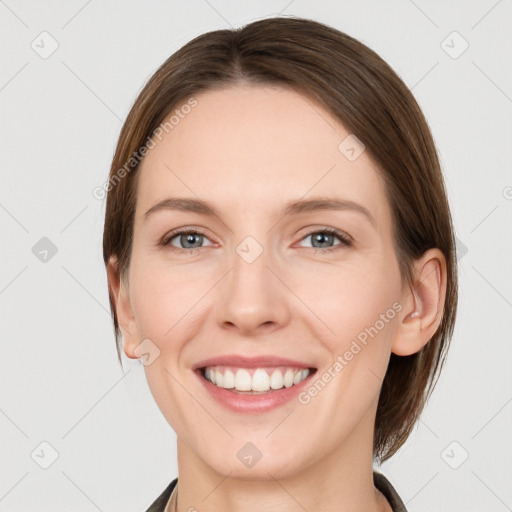 Joyful white young-adult female with medium  brown hair and grey eyes