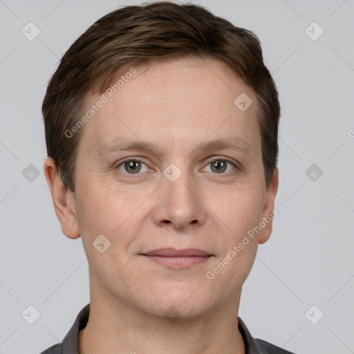 Joyful white adult female with short  brown hair and grey eyes