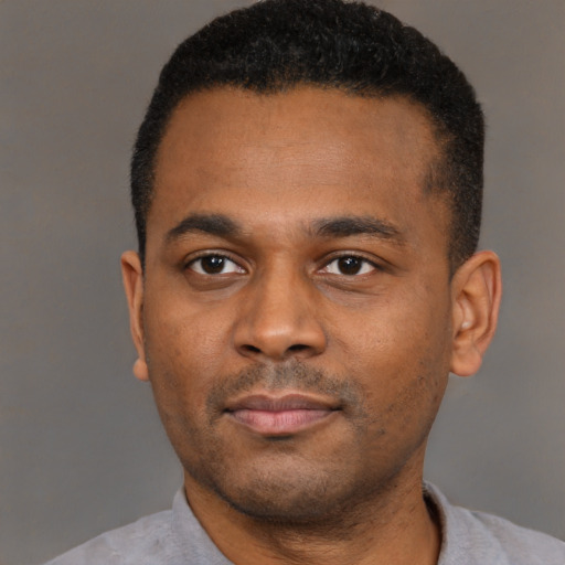 Neutral black young-adult male with short  black hair and brown eyes