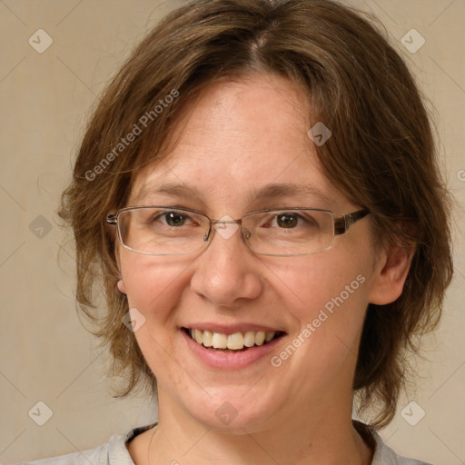 Joyful white adult female with medium  brown hair and green eyes