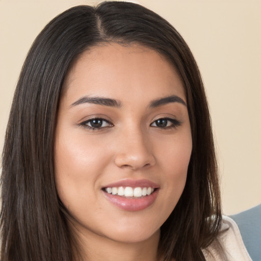 Joyful white young-adult female with long  brown hair and brown eyes