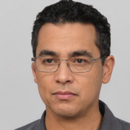Neutral white adult male with short  black hair and brown eyes
