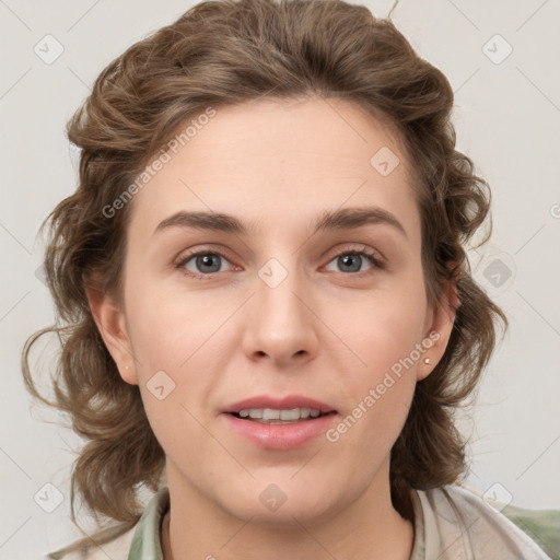 Joyful white young-adult female with medium  brown hair and green eyes