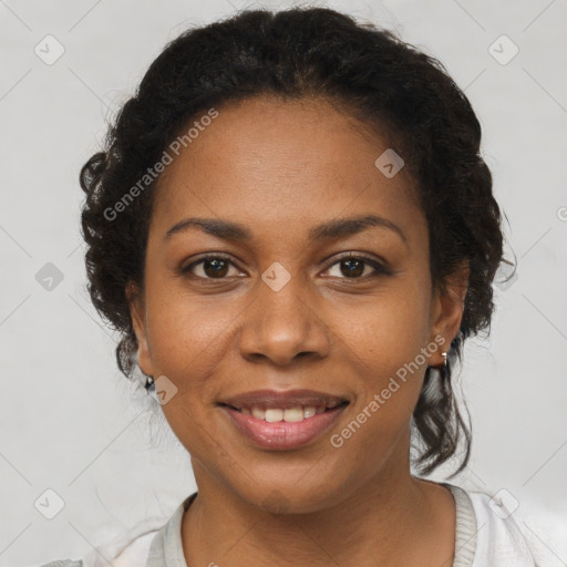 Joyful black adult female with short  brown hair and brown eyes