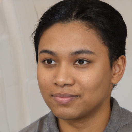 Neutral latino young-adult female with medium  black hair and brown eyes