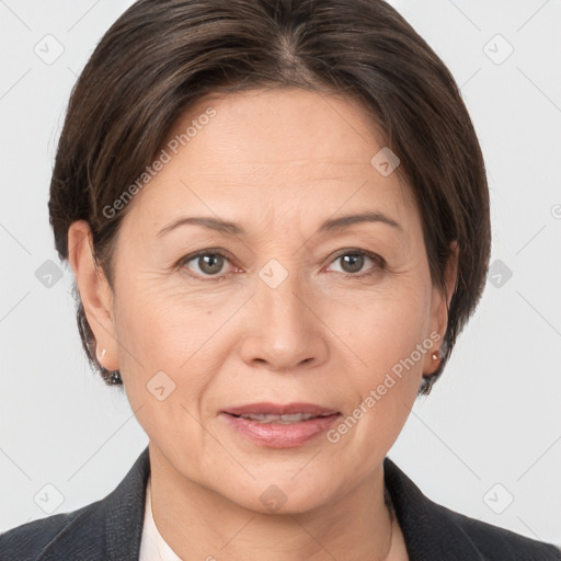 Joyful white adult female with short  brown hair and brown eyes