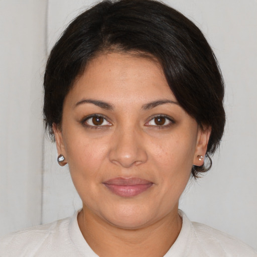 Joyful white young-adult female with medium  brown hair and brown eyes