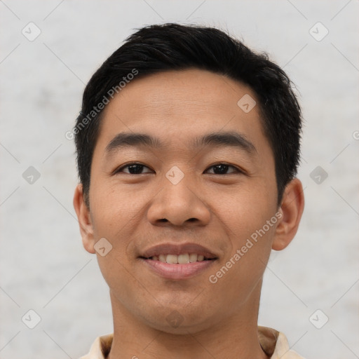 Joyful asian young-adult male with short  black hair and brown eyes