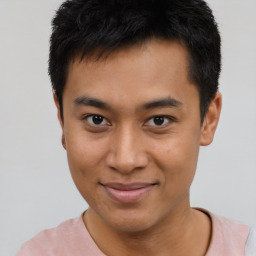 Joyful asian young-adult male with short  black hair and brown eyes