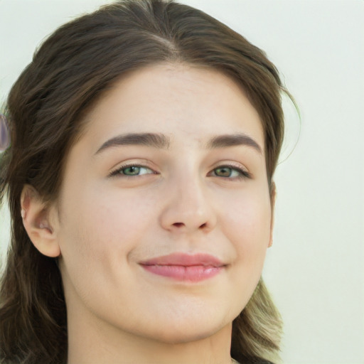 Joyful white young-adult female with long  brown hair and green eyes