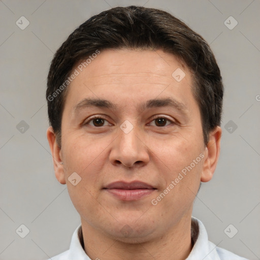 Joyful white adult male with short  brown hair and brown eyes