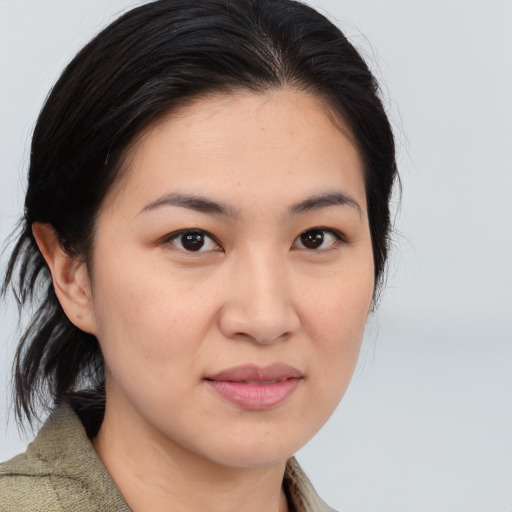 Joyful asian young-adult female with medium  brown hair and brown eyes