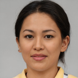 Joyful asian young-adult female with medium  brown hair and brown eyes