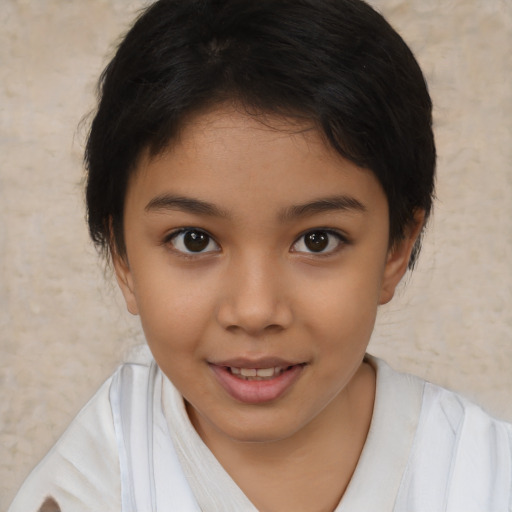 Joyful latino child female with medium  brown hair and brown eyes