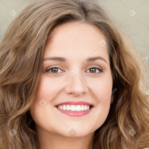 Joyful white young-adult female with long  brown hair and green eyes