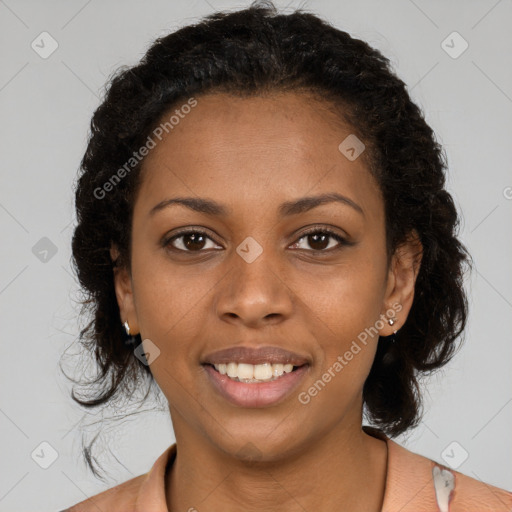 Joyful black young-adult female with long  black hair and brown eyes