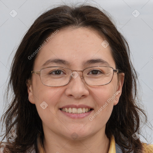 Joyful white adult female with long  brown hair and brown eyes