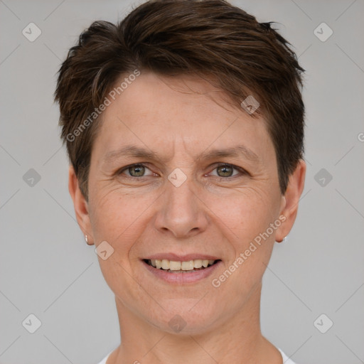 Joyful white adult female with short  brown hair and grey eyes