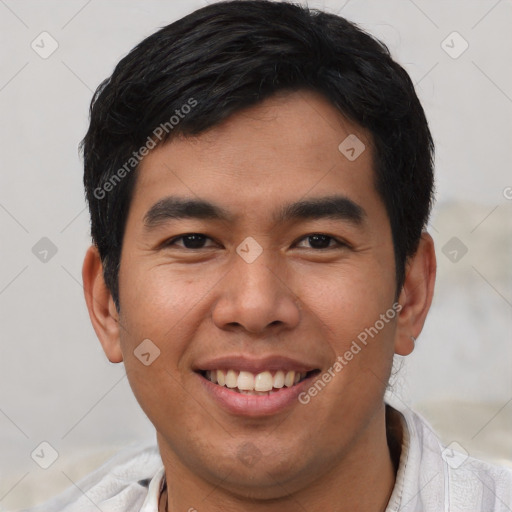 Joyful asian young-adult male with short  black hair and brown eyes