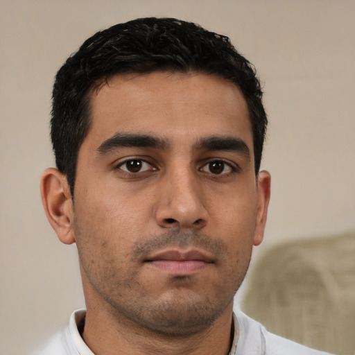 Neutral latino young-adult male with short  black hair and brown eyes