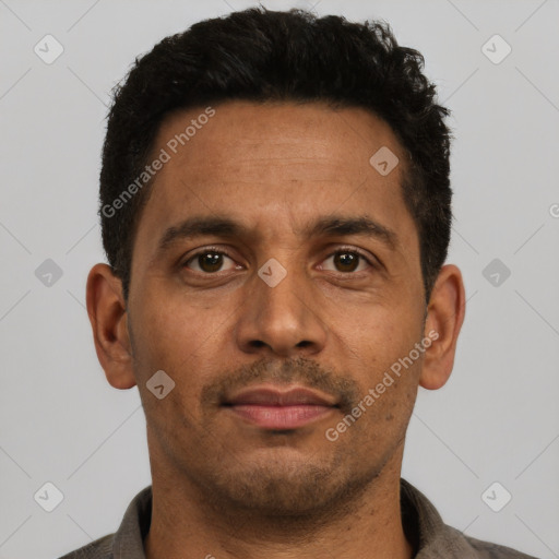 Neutral latino adult male with short  black hair and brown eyes