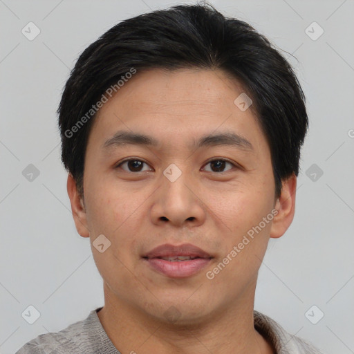 Joyful asian young-adult male with short  brown hair and brown eyes